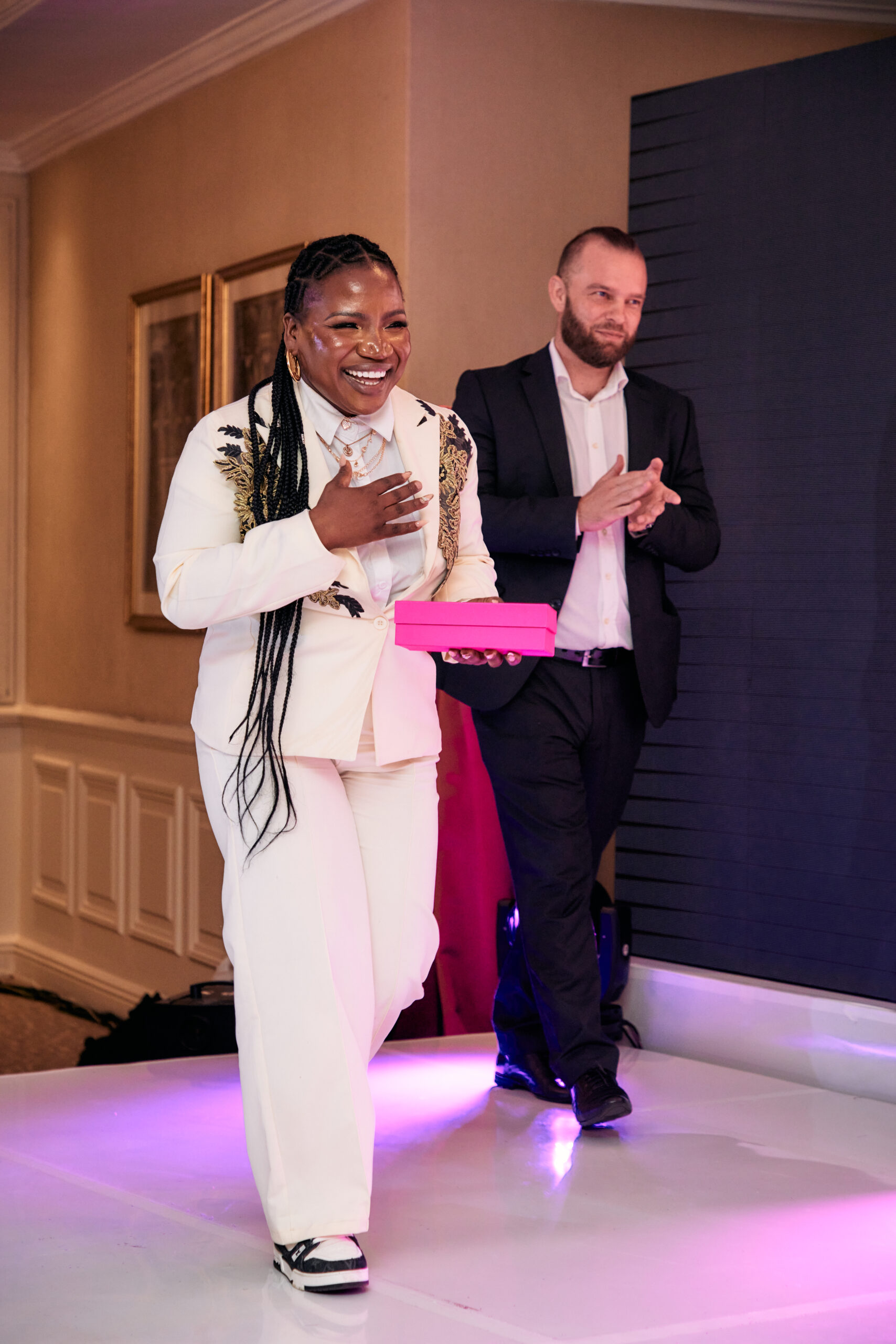 Makhadzi accepts her Entertainer game changer award from Yoann Chaplain. Photo Credit: Warner Music Africa