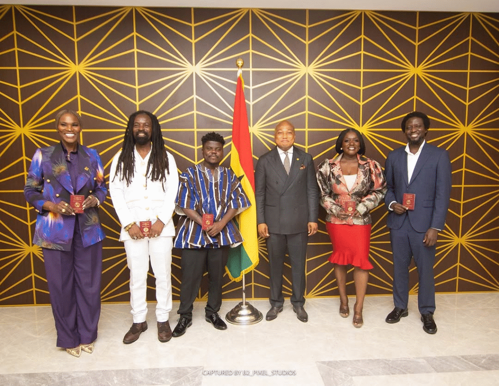 Rocky Dawuni with four other creatives presented with their diplomatic passport by Hon. Okudzeto Ablakwa, Foreign Minister.