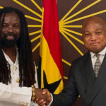 Rocky Dawuni receives his diplomatic passport from Hon. Okudzeto Ablakwa, Foreign Minister.