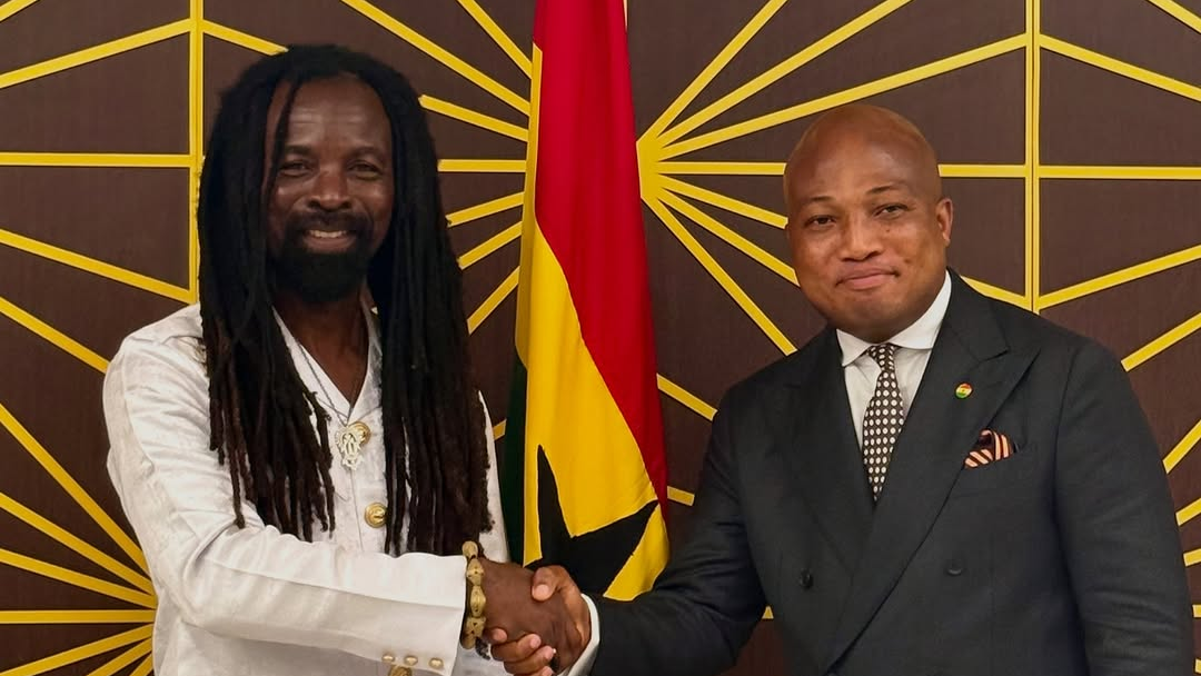 Rocky Dawuni receives his diplomatic passport from Hon. Okudzeto Ablakwa, Foreign Minister.