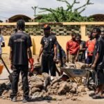 AratheJay and locals during Tema cleanup. Photo Credit: Supplied.